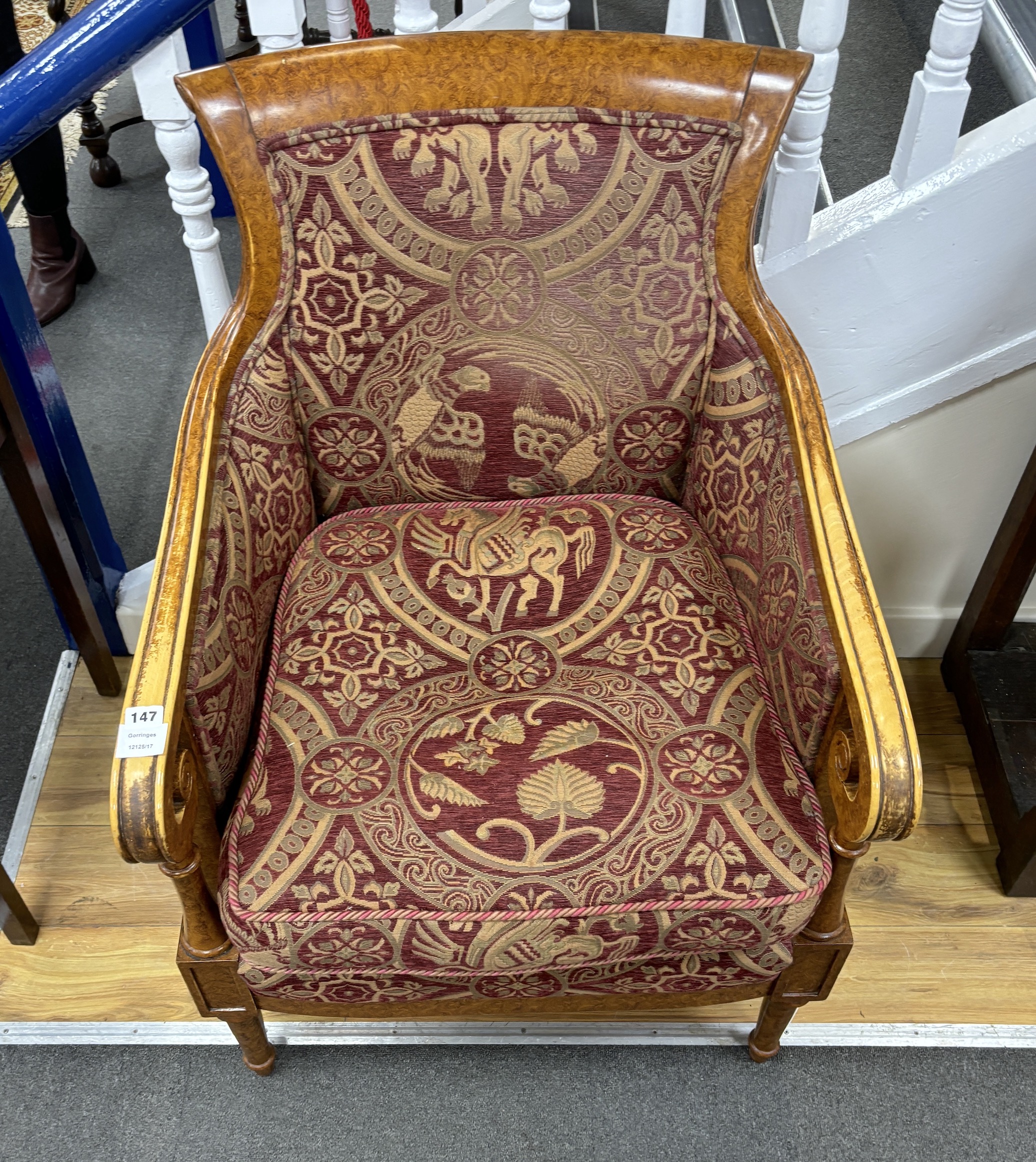 An Empire style bergère armchair, width 67cm, depth 62cm, height 95cm
